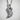 Resting Swan Pendant, polished silver, hanging on chain against wall