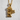 Kneeling Angel Pendant, gold vermeil, product photo on textured surface