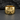 Detailed view of the 14K gold vermeil nautical star ring resting on a dark textured charcoal background