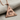 Celestial All-Seeing Eye Pendant, rose gold plated, angled view on fabric