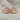 Baby hands birthstone ring, rose gold, front view on fabric