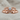 Baby hands birthstone ring, rose gold, front view on fabric
