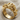 Macro view of the handcrafted cannabis angel ring resting on textured linen fabric showcasing intricate metalwork.