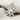 Twisted Rope Sun Pendant, polished silver, angled view on textured fabric
