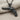 Checkered Grip Revolver Pendant, black rhodium, front view on fabric