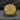 Close-up of Special Forces ring with De Oppresso Liber motto engraving displayed on a dark stone surface