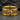 Detailed view of the military eagle design on the Semper Fidelis ring displayed on a dark textured stone surface