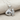 Fantail Goldfish Pendant, polished silver, product photo on fabric
