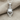 Hockey Goalie Mask Pendant, polished, front view on fabric