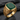 Close-up of green agate signet ring highlighting the deep green cushion-cut stone, AMOR FATI engraving, and floral scrolls