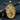 Detailed two-tone Icarus pendant soaring towards a silver sun displayed on dark textured stone and wood branches