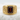 Macro detailed view of the 14K gold vermeil Greek key ring resting beautifully on a textured white stone background