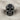 Gothic Rosette Skull Ring, black rhodium plated, front view on linen