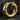 Close-up of chunky gold hammered hoop earring resting on dark stone displaying planished facets and hinged closure