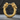 Close-up of crafted gold vermeil wolf hoop earring resting on dark stone highlighting intricate fur texture