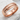 Samurai Katana Ring, rose gold, angled view on white stone