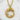 Close-up of the intricately carved ouroboros dragon pendant resting on a textured white stone surface