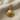 Ridged Scallop Shell Earring, gold vermeil, front view on fabric