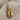 Cowrie Shell Earring in gold vermeil, product photo on fabric