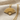 Hand fan pendant, gold vermeil, angled view on textured fabric