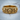 Close-up of the handcrafted royal skull ring on a wooden surface highlighting premium jewelry craftsmanship