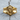Close-up of the intricately carved praying Jesus ring resting on a textured wooden surface highlighting craftsmanship