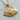 Close-up of the handcrafted royal flush pendant resting on a light wooden surface highlighting the card details