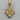 Detailed view of the handcrafted gothic thirteen pendant resting on a rustic wood slice showcasing intricate patterns.