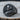 Napoleon Bonaparte Signet Ring, angled front view on round wood slice