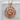 Rose Bouquet Pendant, rose gold, front view on stone pedestal