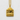 Mount Fuji Pendant, gold vermeil, front view on textured plaster