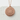 Cherry Blossom Pendant, rose gold, front view on stone surface