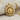 Horned Hittite Sun Pendant, gold vermeil finish on fabric backdrop
