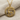 Two-tone Hittite stag pendant featuring a detailed gold vermeil deer on an oxidized 925 silver sun-disk frame.