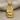 Teshub Storm God Pendant, gold vermeil finish, front view on fabric