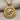 Textured oxidized silver frame and gold roaring lion coin detail of the ancient pendant