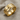 Teshub lightning ring, gold vermeil, angled studio view on textured fabric