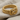 Gordian Knot Ring, gold vermeil, angled view on fabric