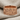 Urartu Warrior Frieze Ring, rose gold, product photo on linen