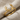 Close-up of the stag antler ring resting on textured fabric showcasing the polished tines and subtle oxidation details