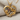 Mother Child Embrace Pendant, gold vermeil, front view on fabric