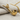 Tobacco Pipe Pendant, gold vermeil, side profile view on fabric