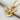 Peace Dove Pendant, gold vermeil, angled view on fabric