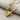 Ballet Dancer Pendant, gold vermeil, angled product photo on fabric