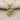 Rose Heart Pendant, gold vermeil, product photo on textured fabric