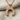 Inverted Horseshoe Pendant, rose gold, on chain against fabric background