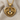 Heart frame baby feet pendant, gold vermeil, front product view on fabric
