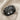 Eagle Crest Band Ring, black rhodium plated, angled product photo on fabric