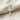 Passion Nail Cross Pendant, polished silver, front view on linen fabric
