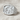 Star of Bethlehem Nativity Ring in polished silver, angled view on fabric